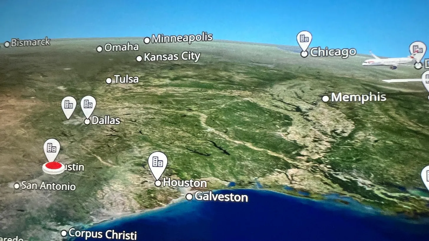 In-flight map view from airplane window