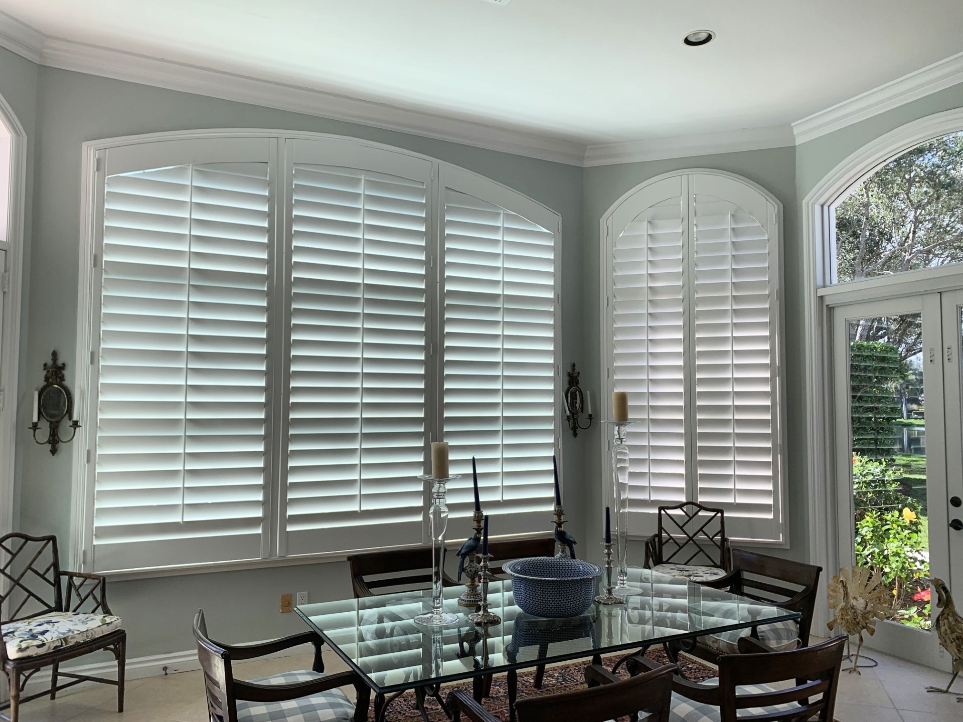 Sample custom wood shutters in dining room