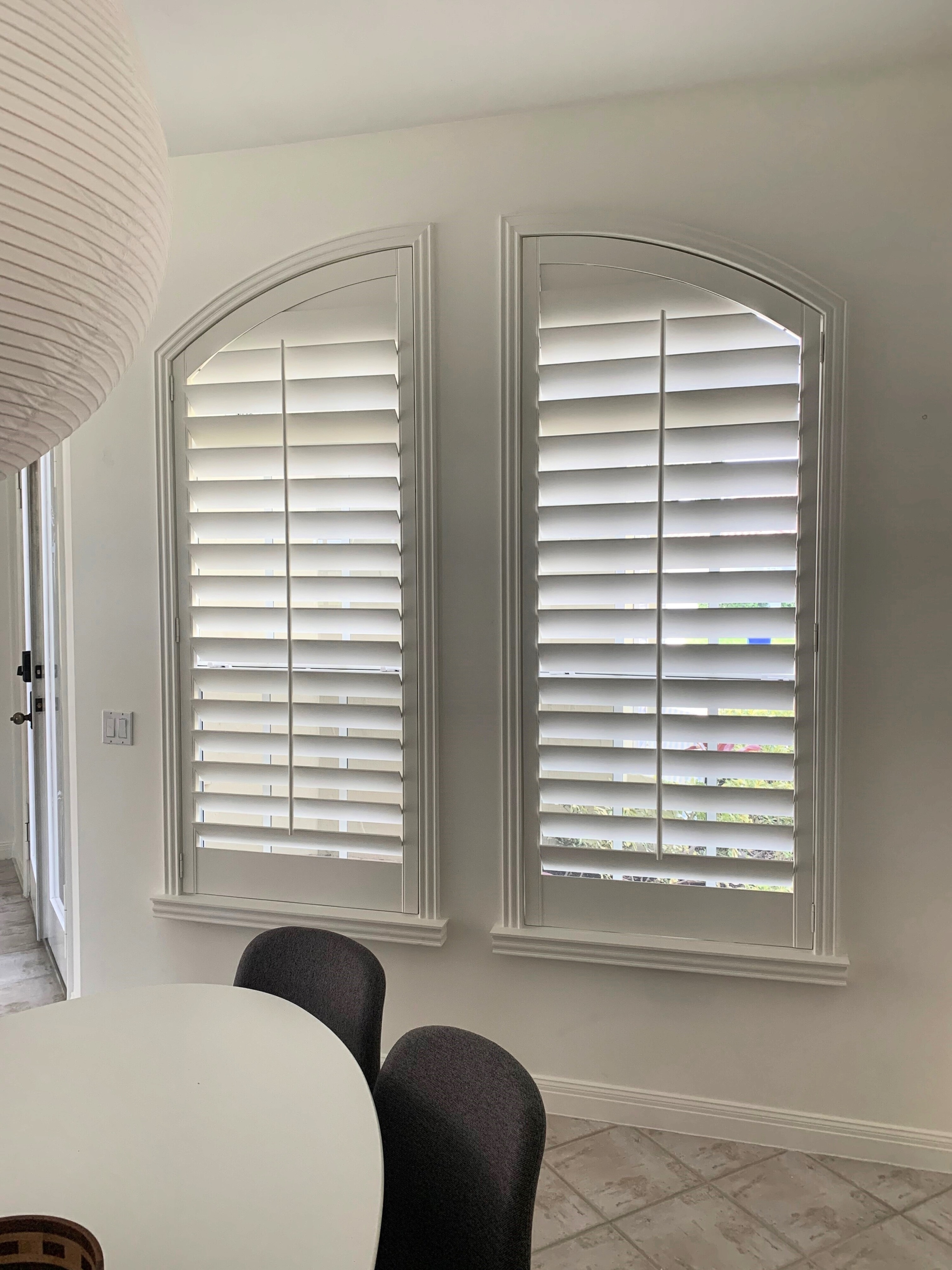 Sample custom wood shutters with an arch shape