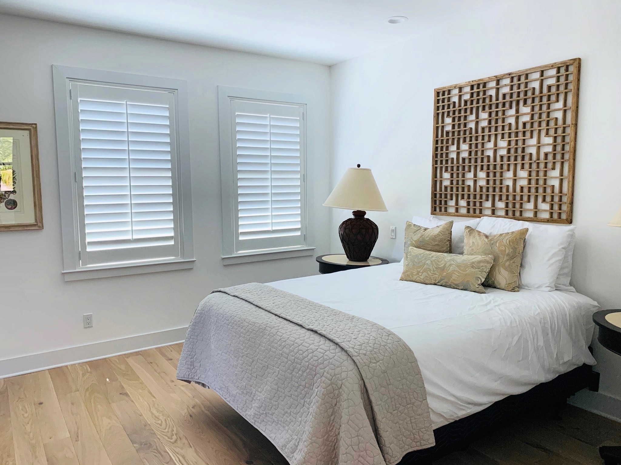 Sample custom wood shutters in bedroom