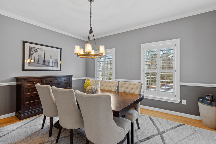 Sample custom wood shutters in dining room