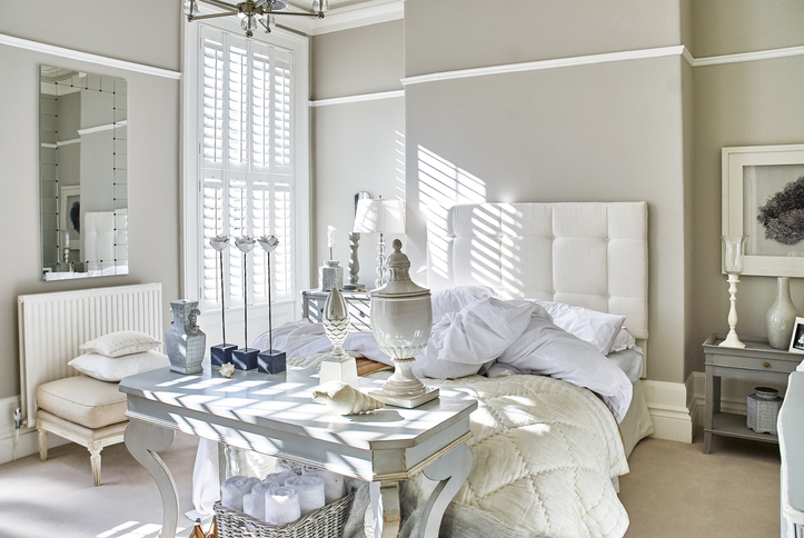 Sample custom wood shutters in bedroom
