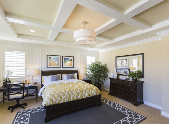 Sample custom wood shutters in bedroom