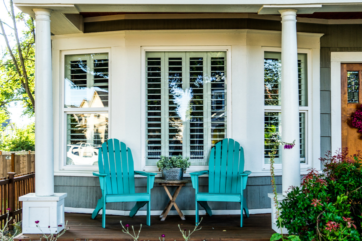 Sample wood shutters in living room, seen from the outside of the home