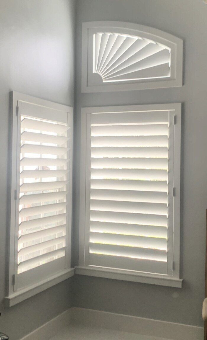 Corner installation with fan arch plantation shutters
