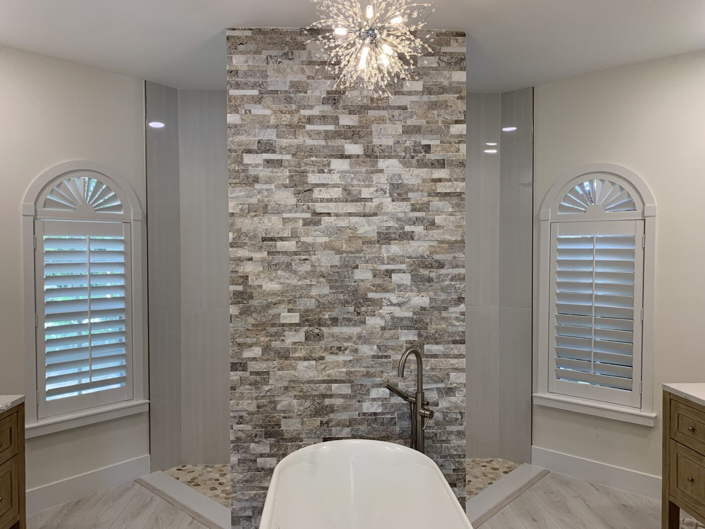Custom real-wood plantation shutters on dual arched windows in a Fort Pierce, FL home
