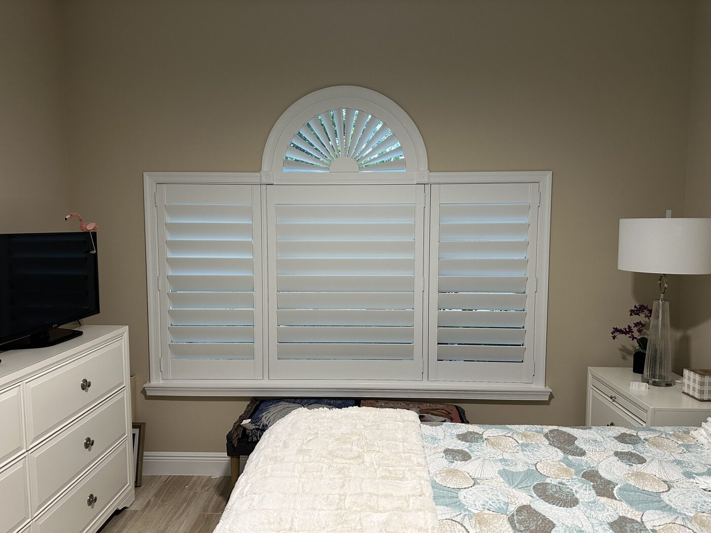 Bedroom plantation shutters with half moon arch