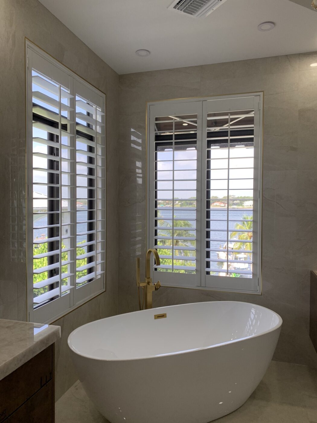 Plantation shutters with Indian River view in Sewall's Point master bath