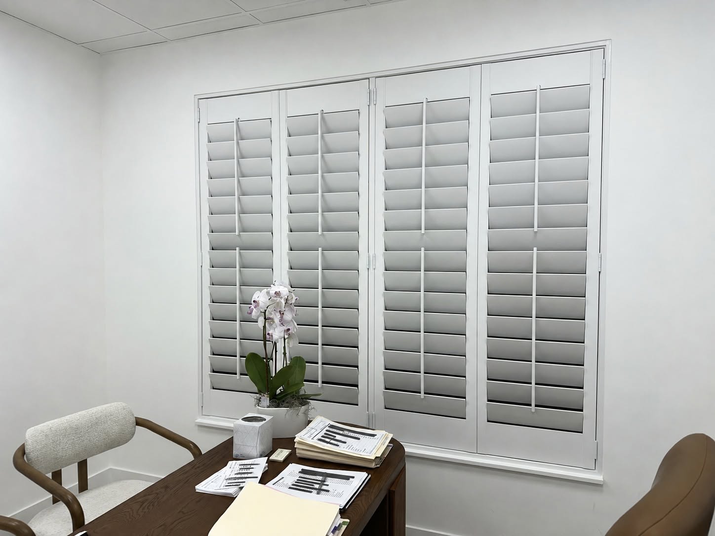 Custom real-wood plantation shutters in a home office on the Treasure Coast