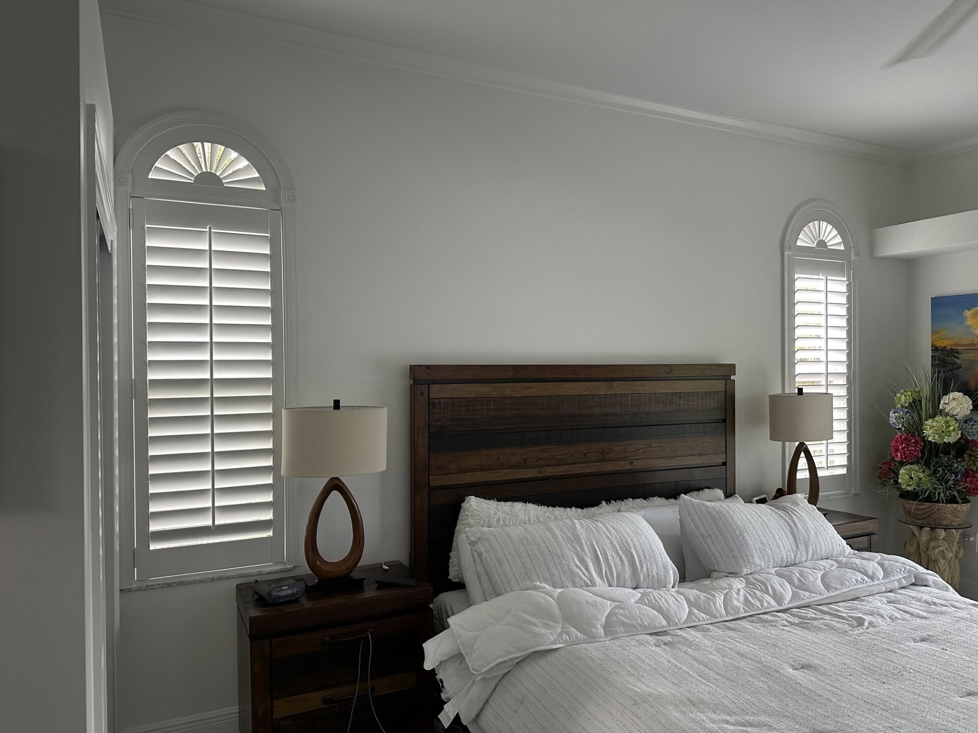 Real-wood plantation shutters in a Sewall's Point, FL bedroom