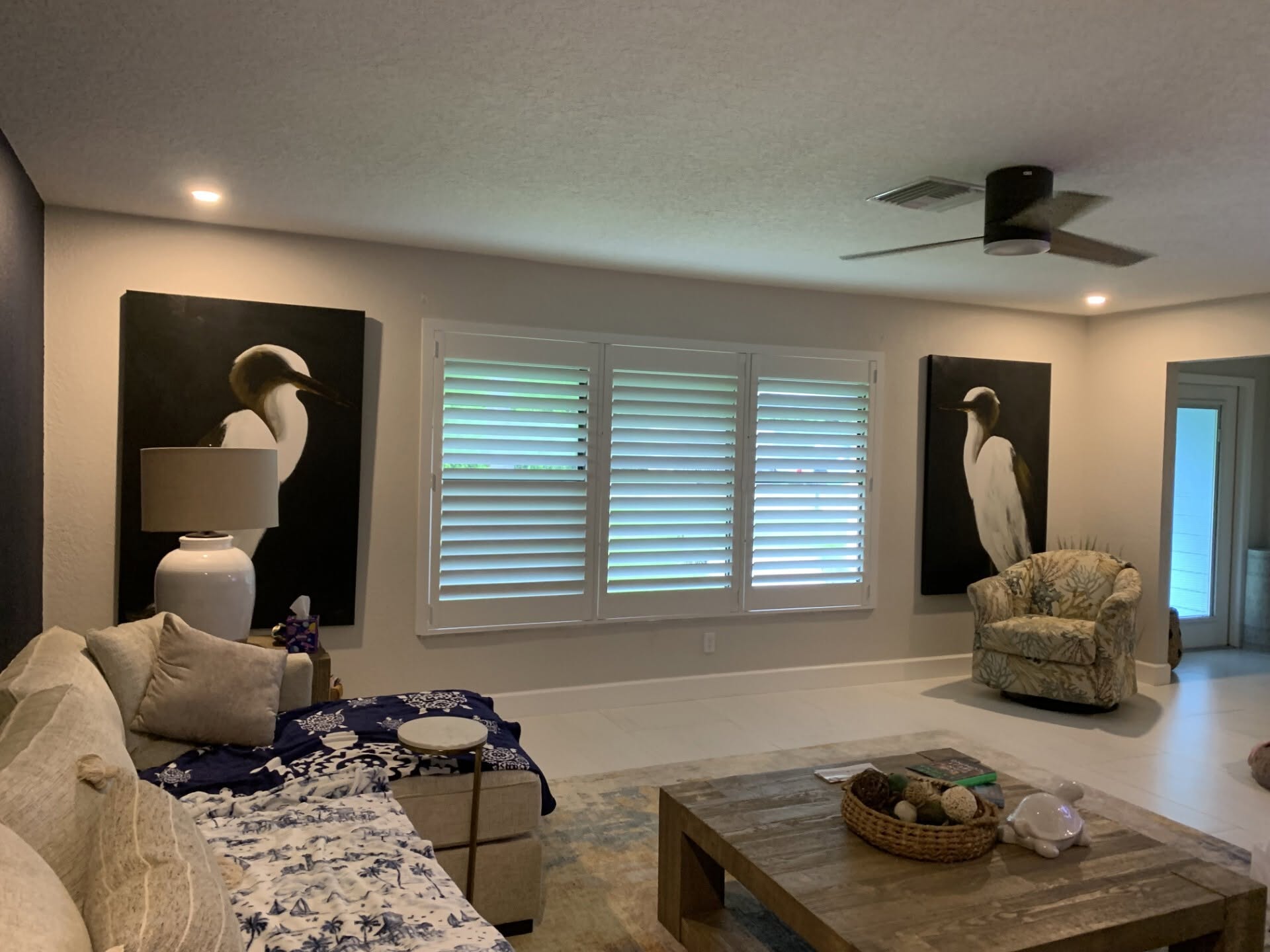 Custom real-wood plantation shutters installed in a Hobe Sound, FL living room