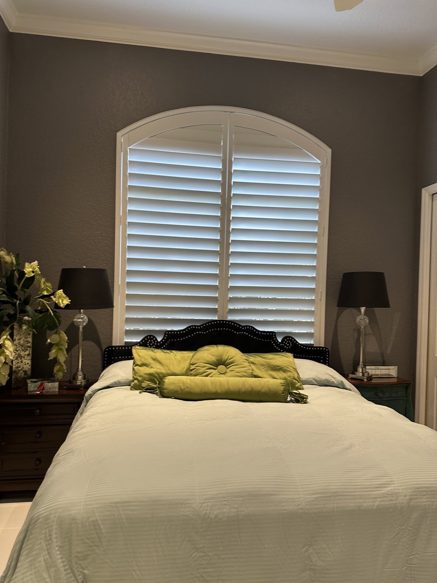 Real-wood plantation shutters installed in a client's bedroom near Jensen Beach, FL