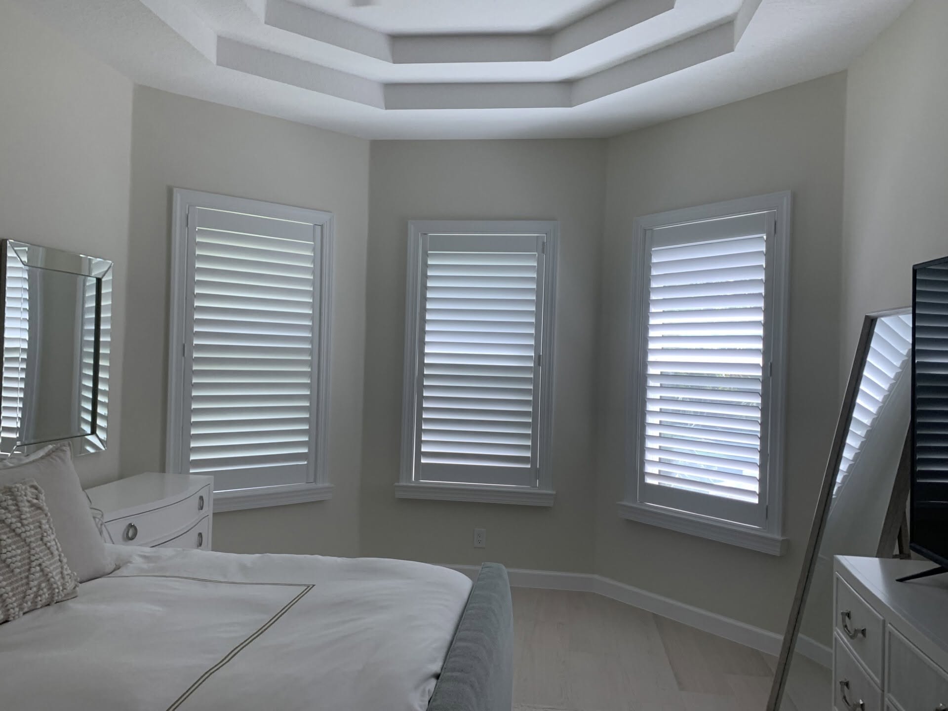 Real-wood plantation shutters installed in a client's bedroom near Hobe Sound, FL
