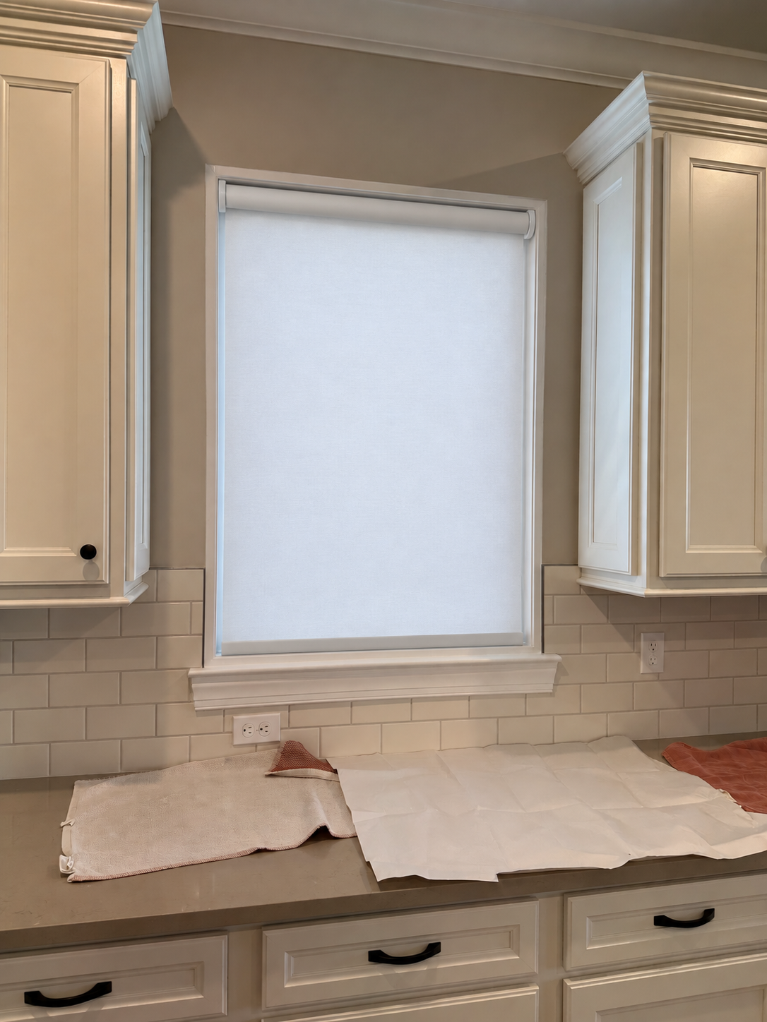 AI visualization of a basic white roller shade in the same kitchen window