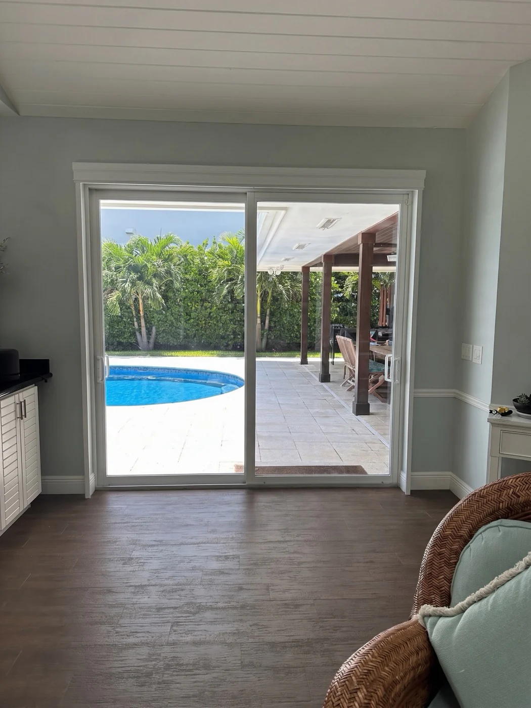 Sliding Glass Door before custom plantation shutters by Architectural Plantation Shutters