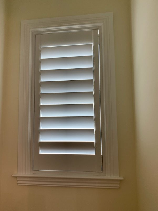 Tall plantation shutter built to fit an existing stepped window casing, Abacoa, Jupiter, FL
