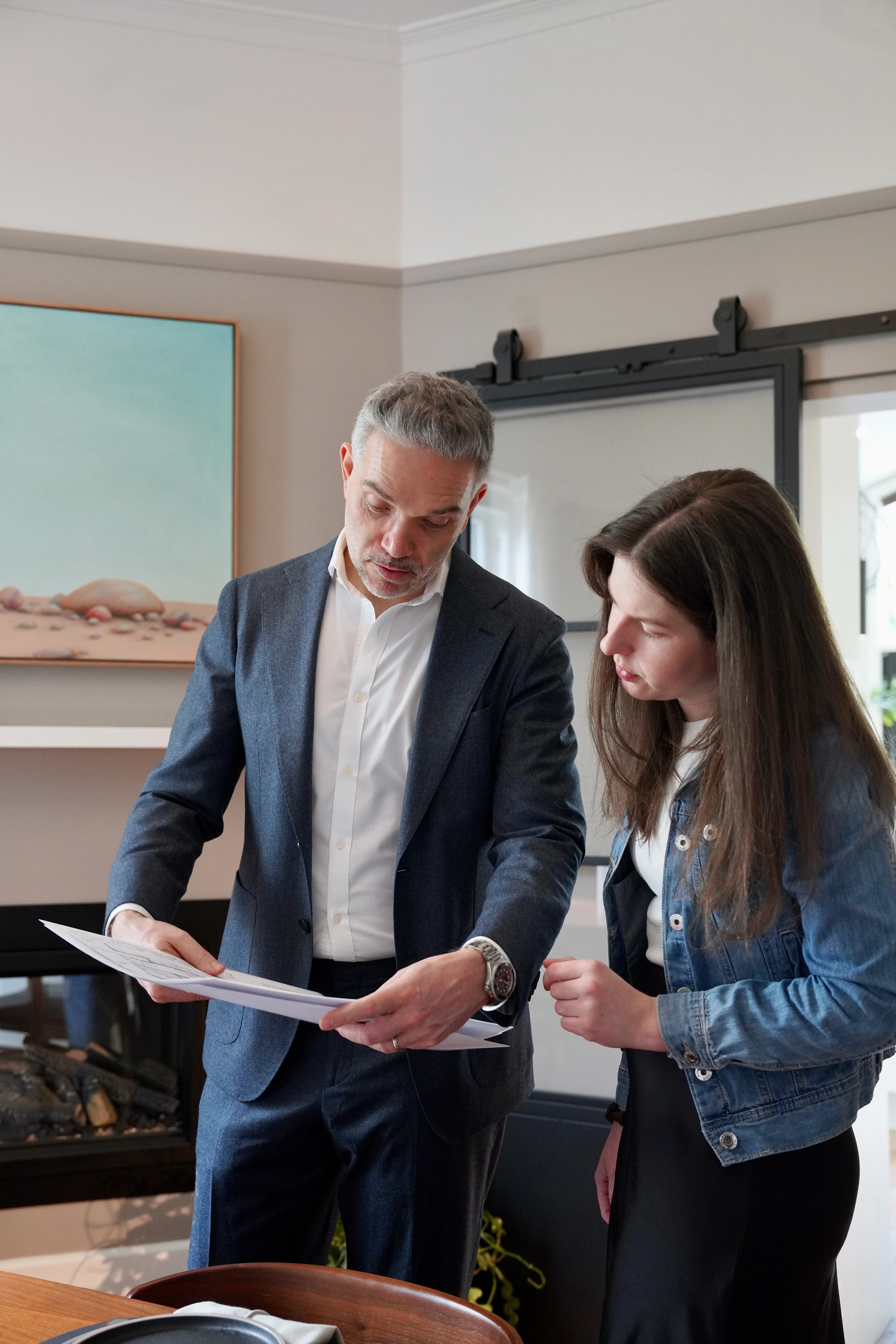 Sven Fischer of Cottage & Castle reviewing property documents with a client