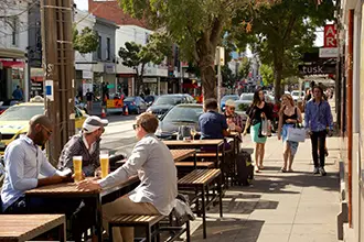 a scnenic image of people sitting in a cafe on one os south yarras streets