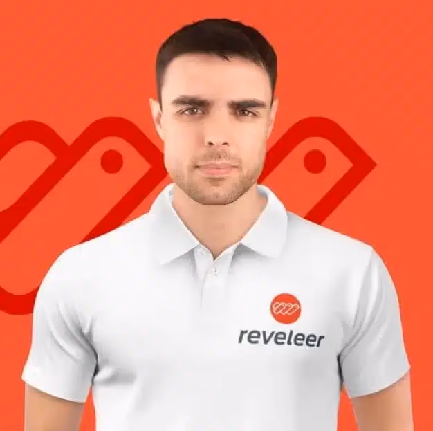 Man with short dark hair wearing a white polo shirt with a red Reveler logo on an orange background.