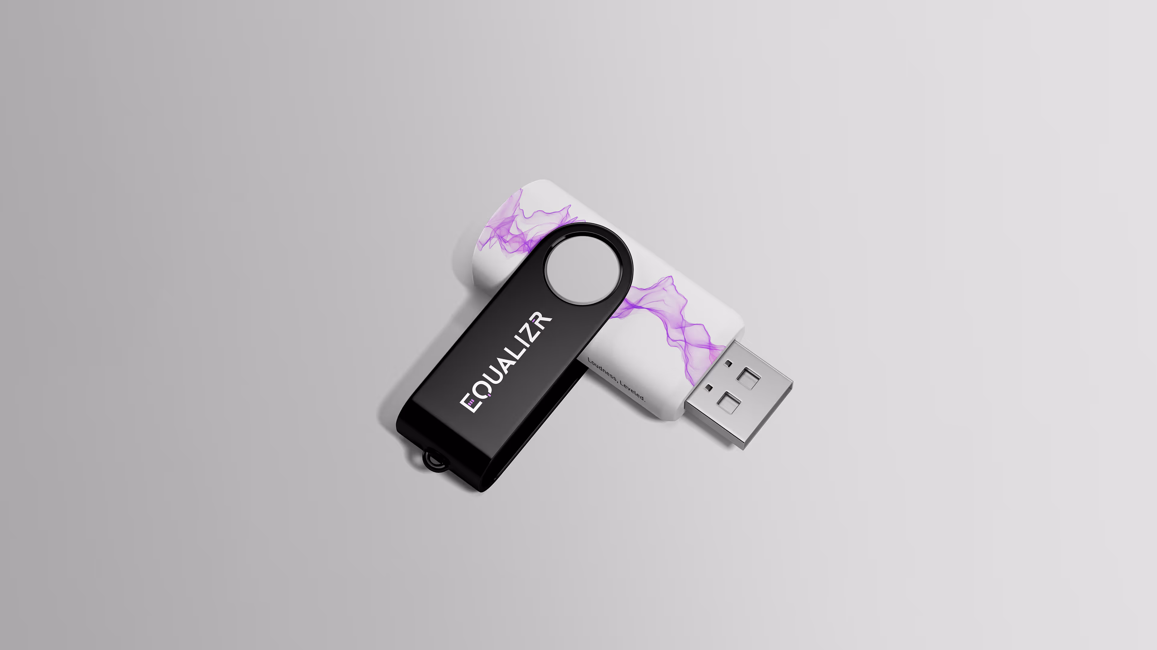 Black USB flash drive with the EQUALIZR logo resting on a white USB case that features a purple wave graphic.