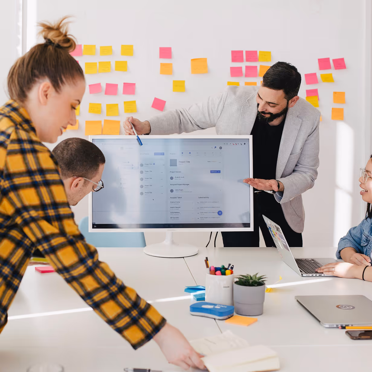 A group of people working in an office room