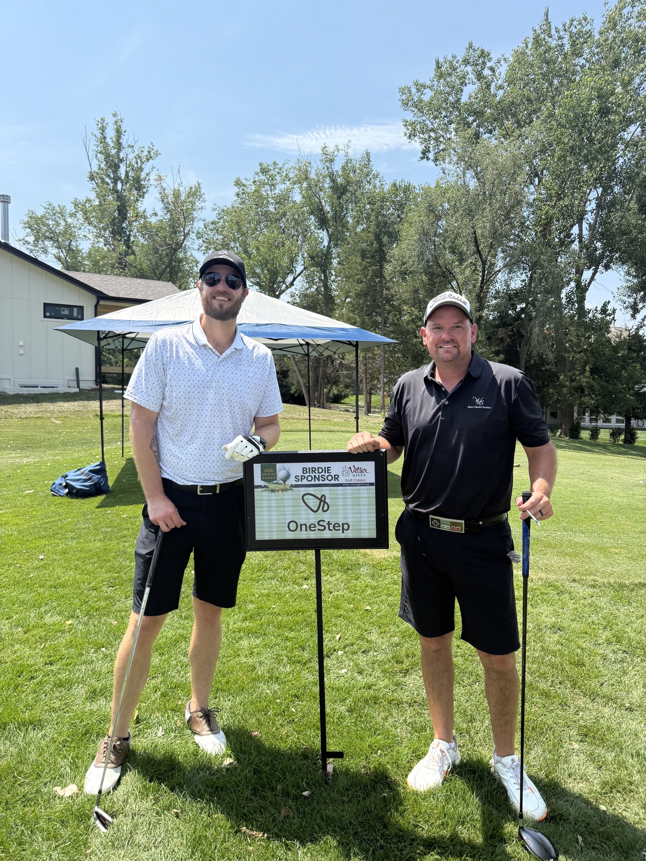 Partnership beyond the platform. Frank Victory and John Brackle at a charity golf event.