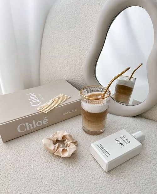 a book, lotion and a small mirror