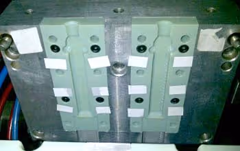 Stratasys 3D printed molds mounted on Plasel’s blow molding machinery