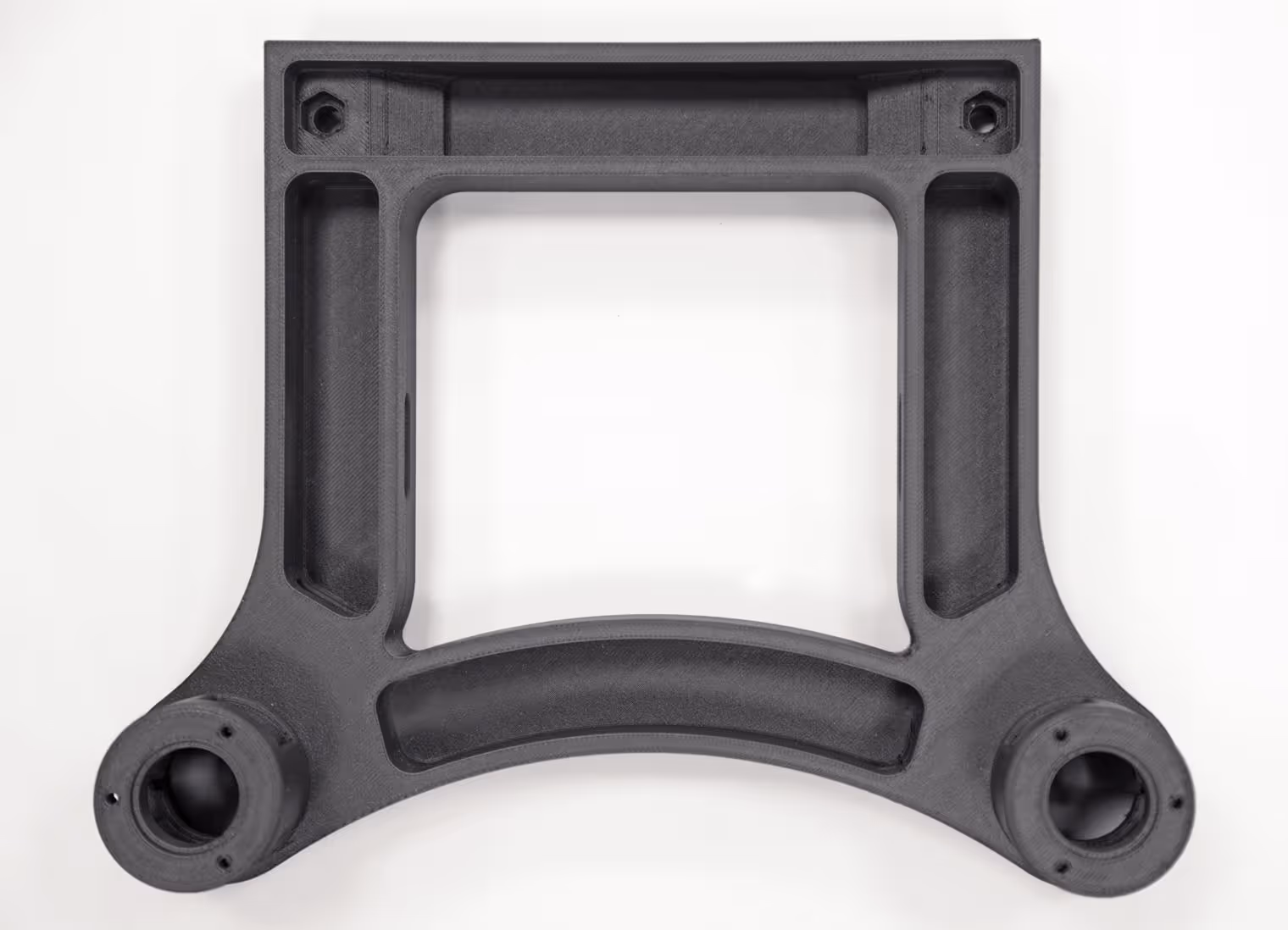 Nylon 12CF fixture used for product handling in a robotic packaging system.