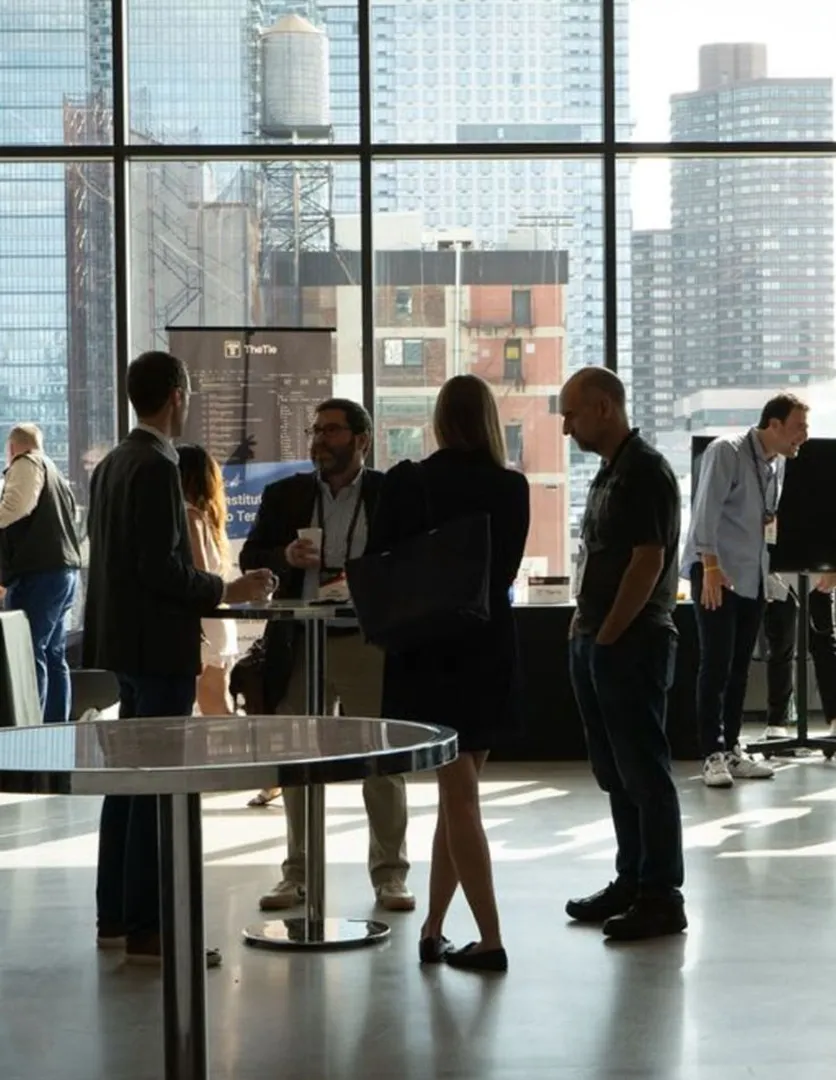 Group of people gathered around table talking