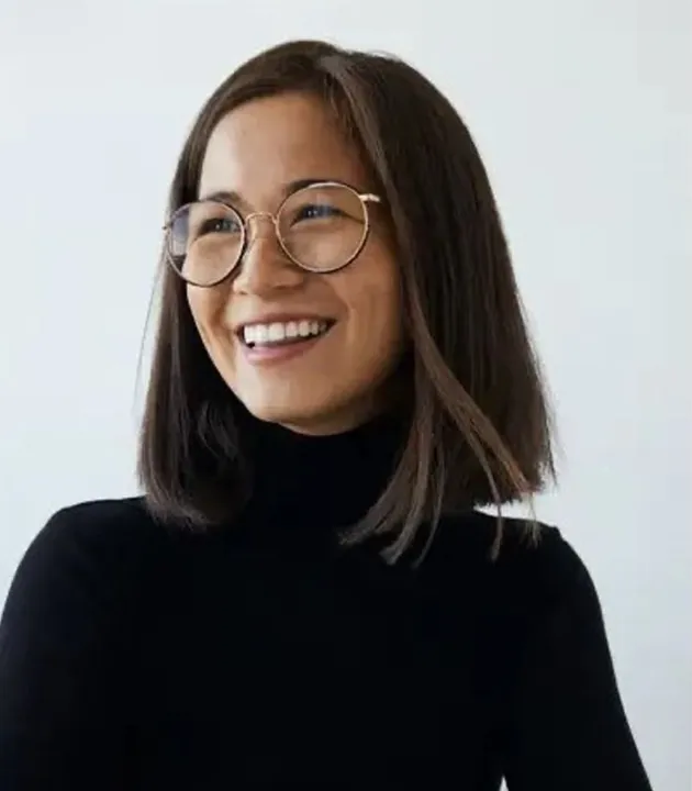 Female smiling in black shirt