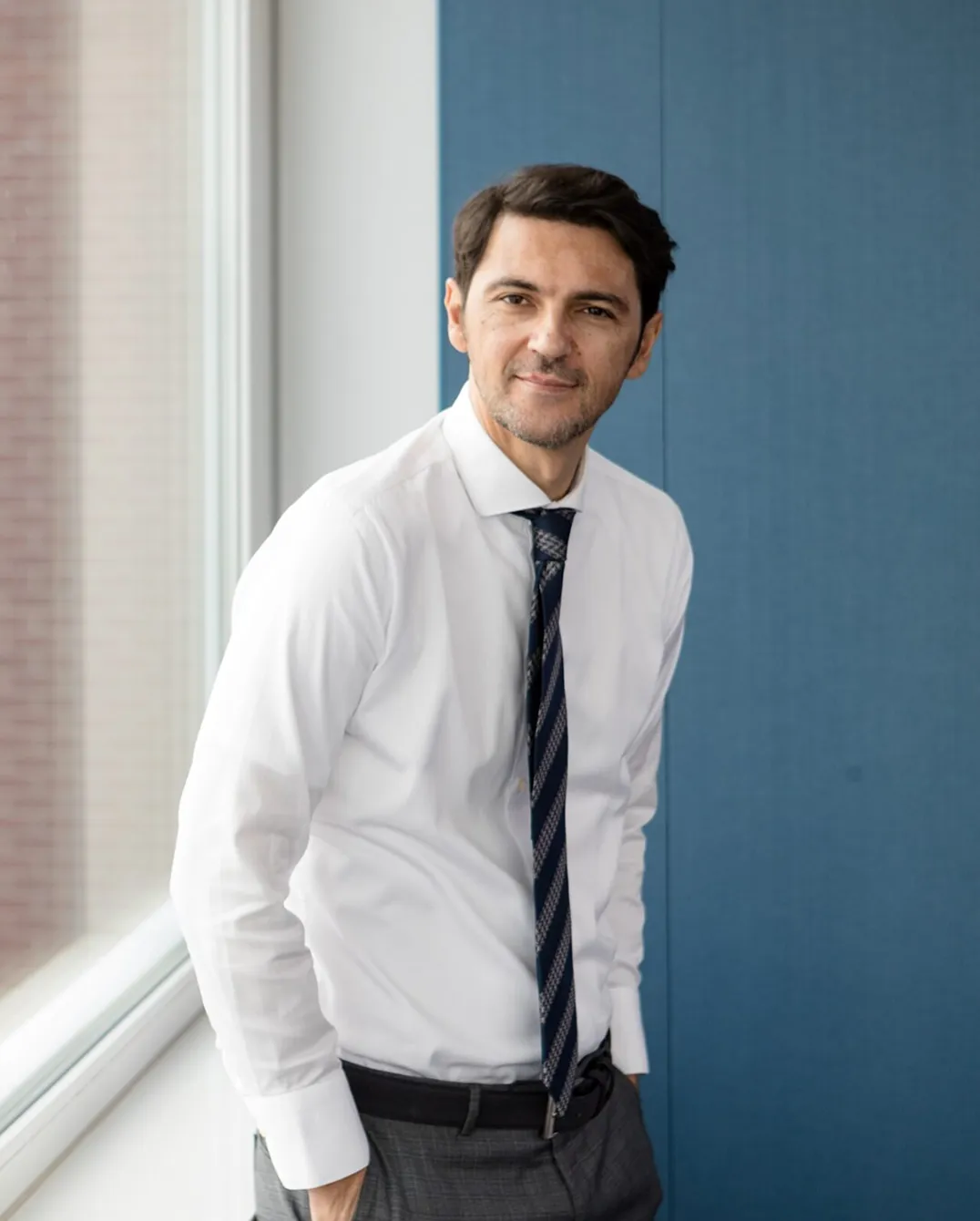 Man smiling in white shirt