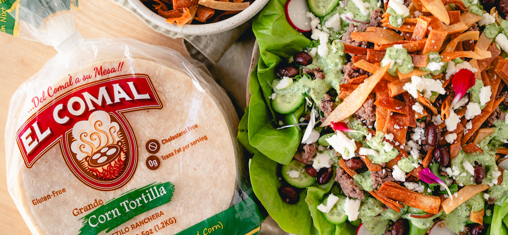 Salad with lettuce, beans, cheese, carrots, radishes, and green dressing