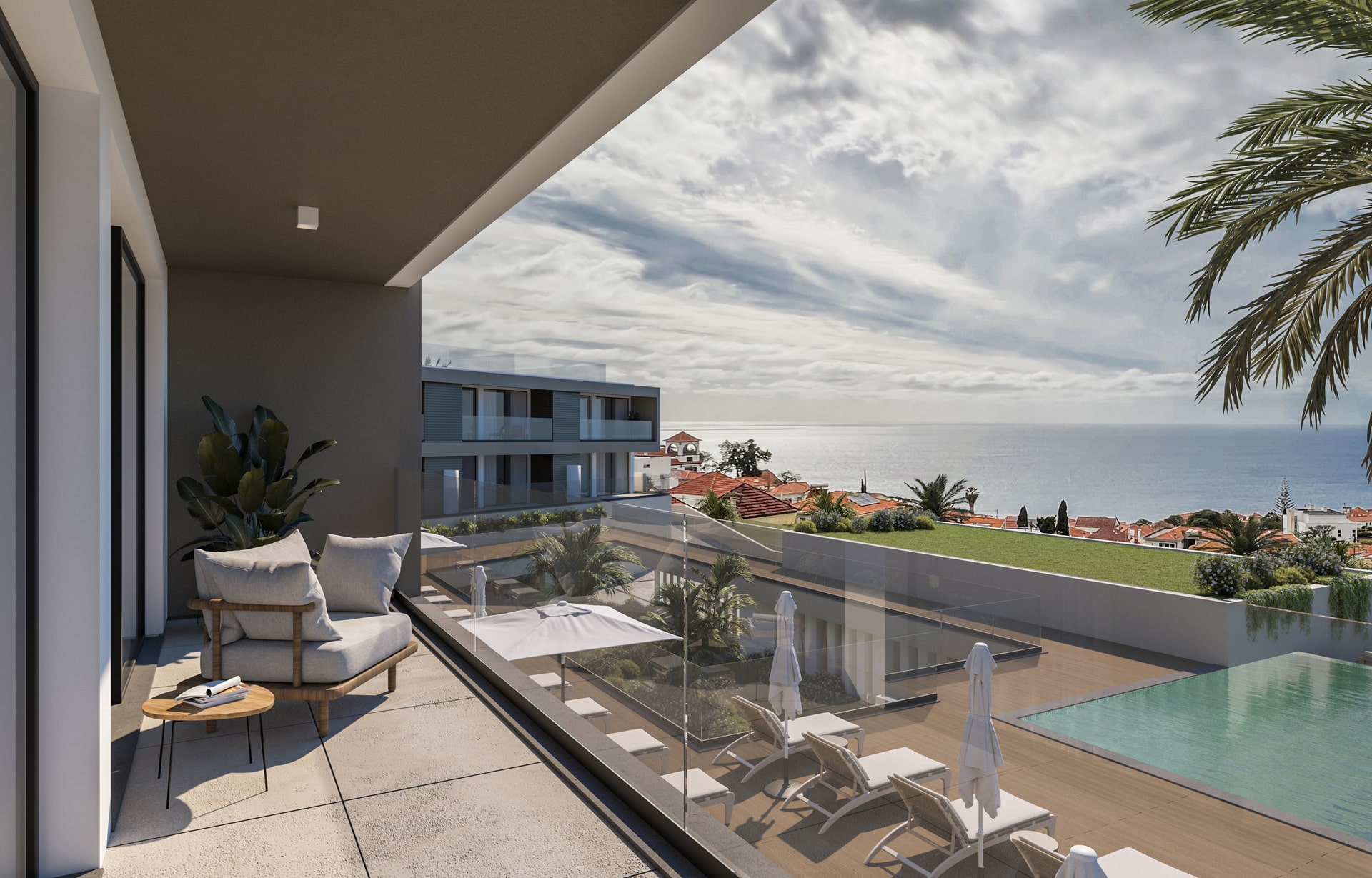 Terraço de um apartamento de luxo, com uma piscina de borda infinita e uma vista panorâmica para o oceano e a paisagem costeira.
