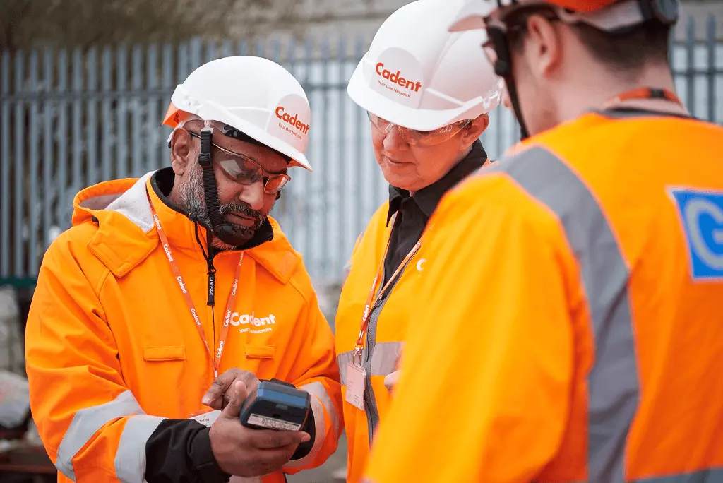 Workers looking at the device