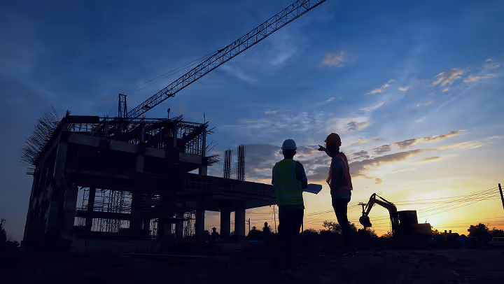 Construction site under a sunset
