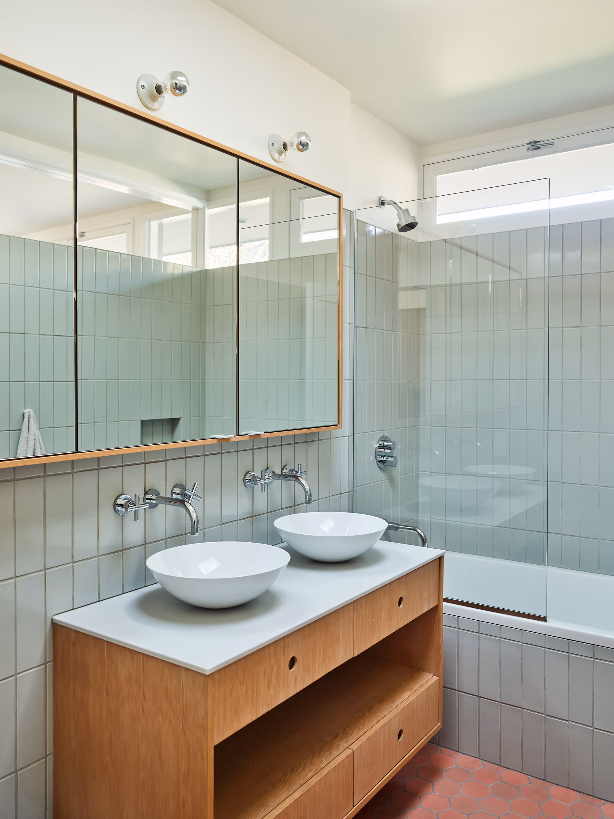bathroom with custom vanity and white tile