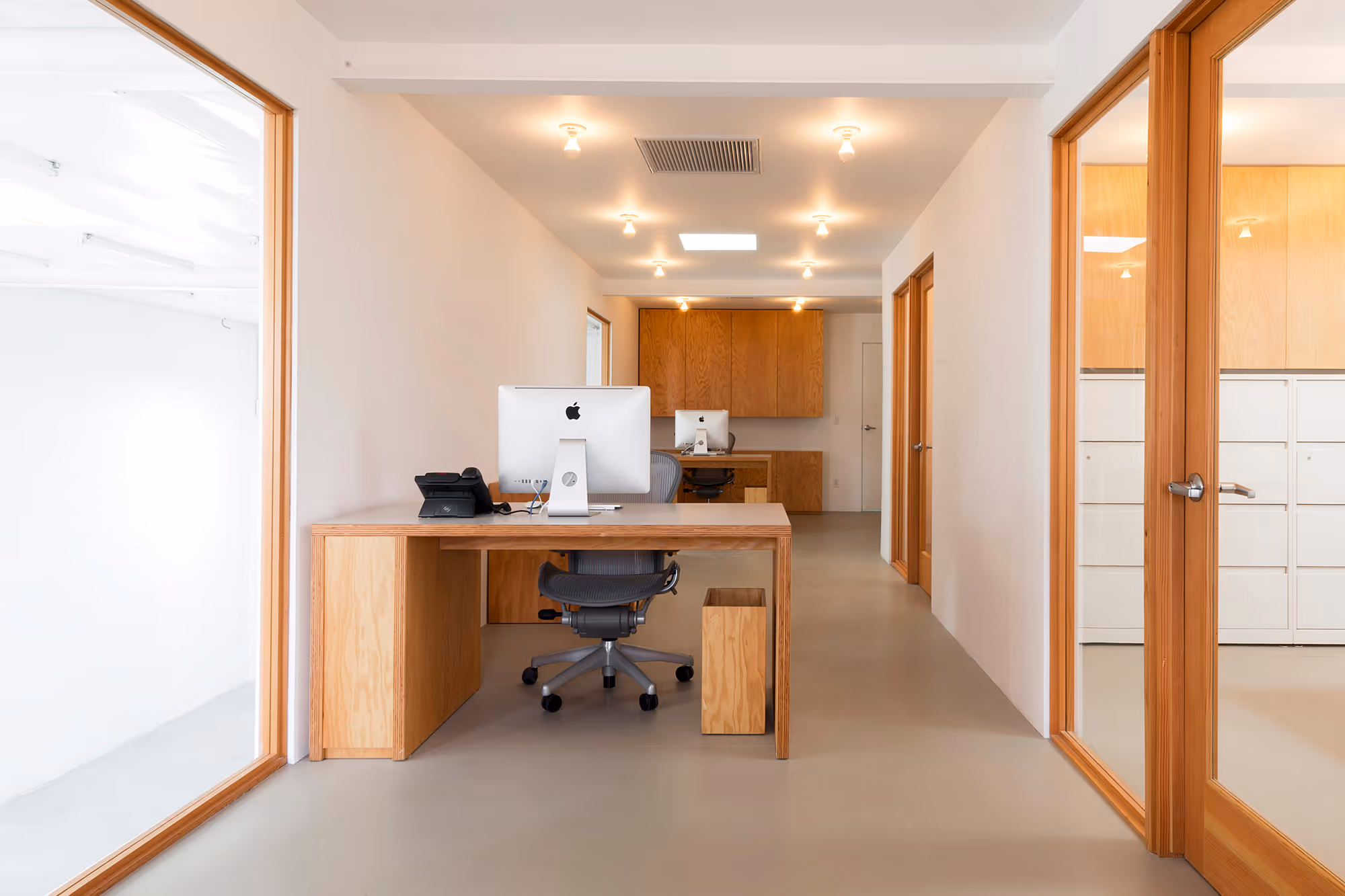 office view with custom desks and door and window casing