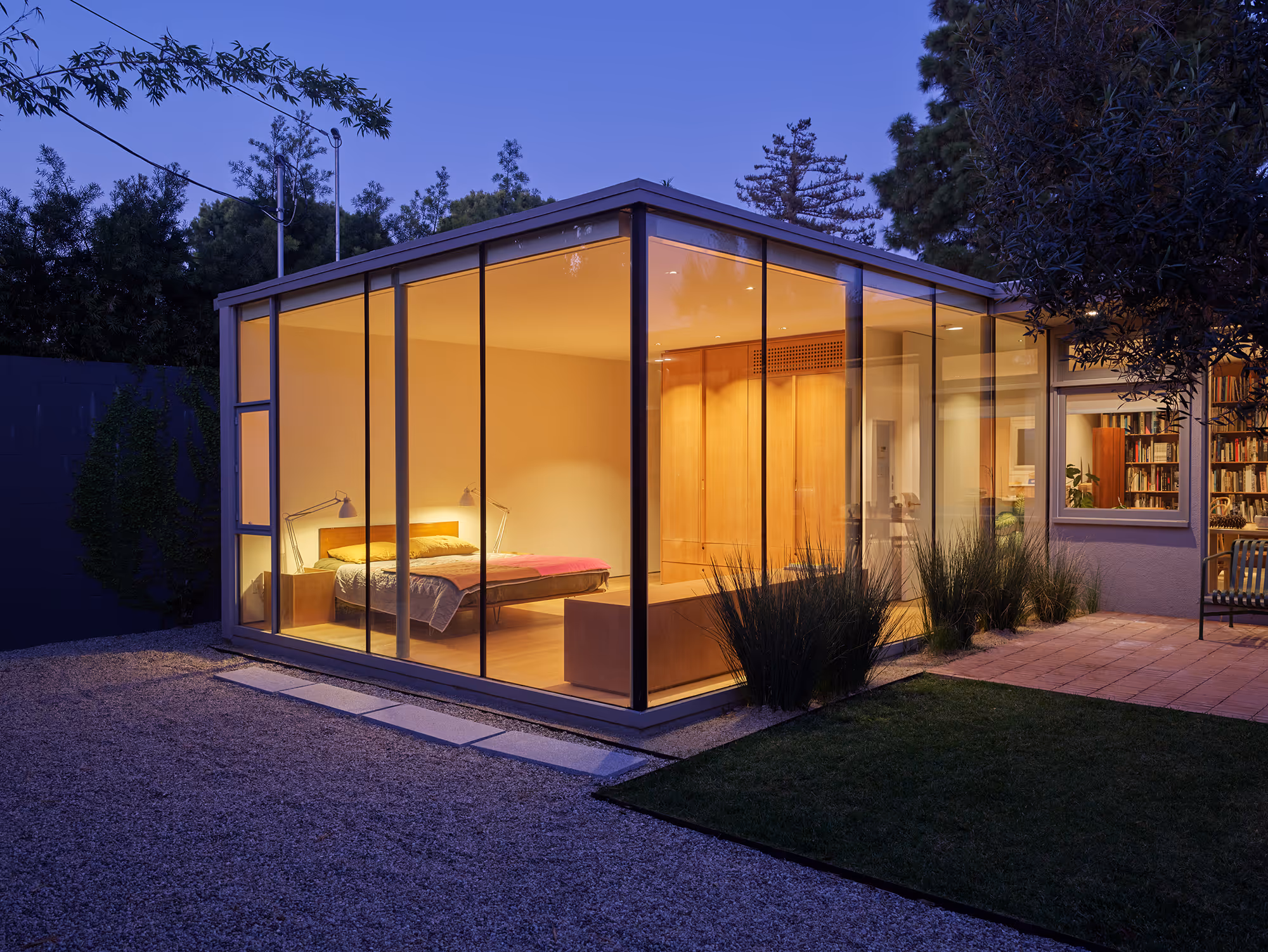 night time view featuring glass walls