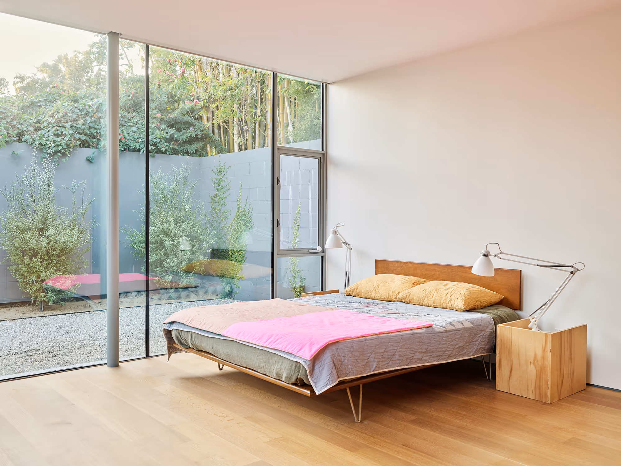 bedroom with custom side tables and looking towards yard