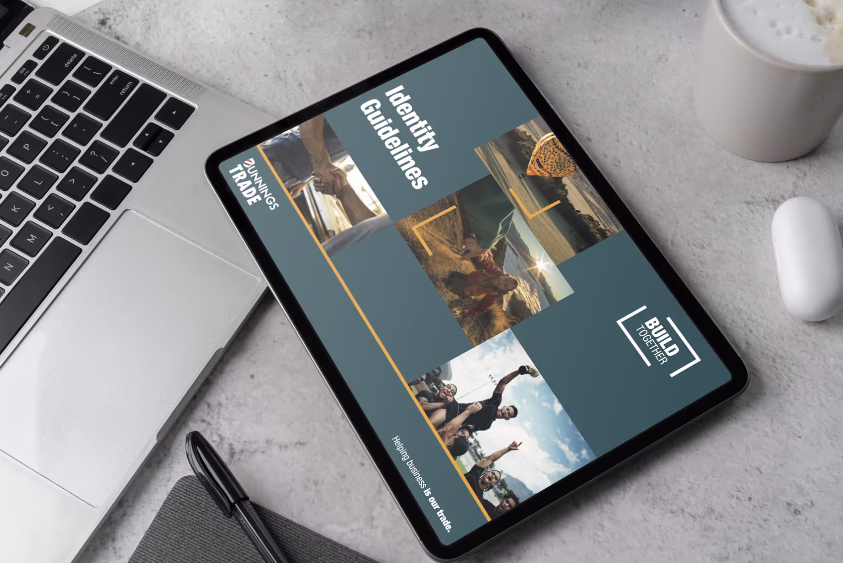 An iPad on a desk showing the cover of the Build Together Trade Initiative style guide.