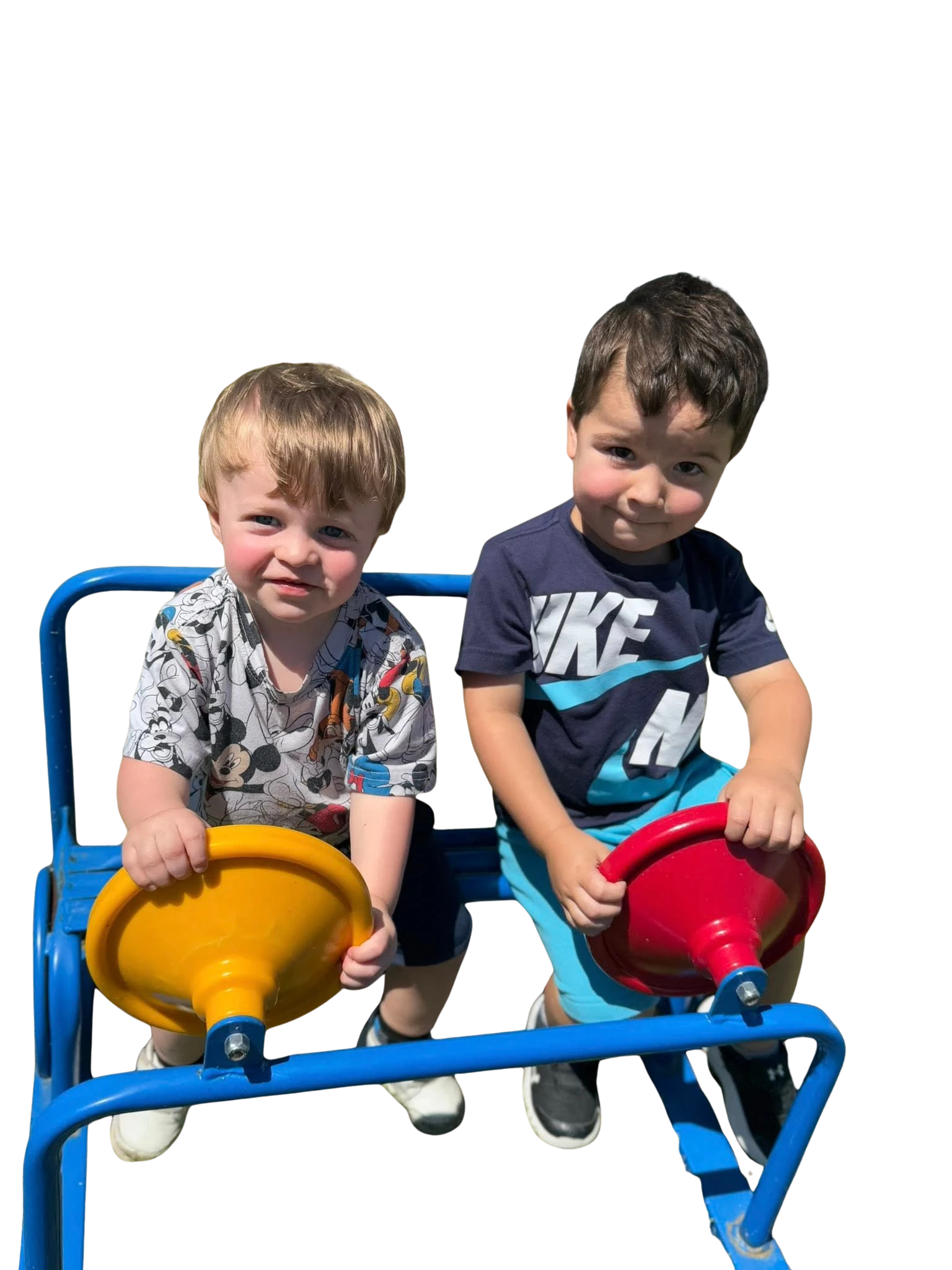 young boys playing on outdoor play set using steering wheels