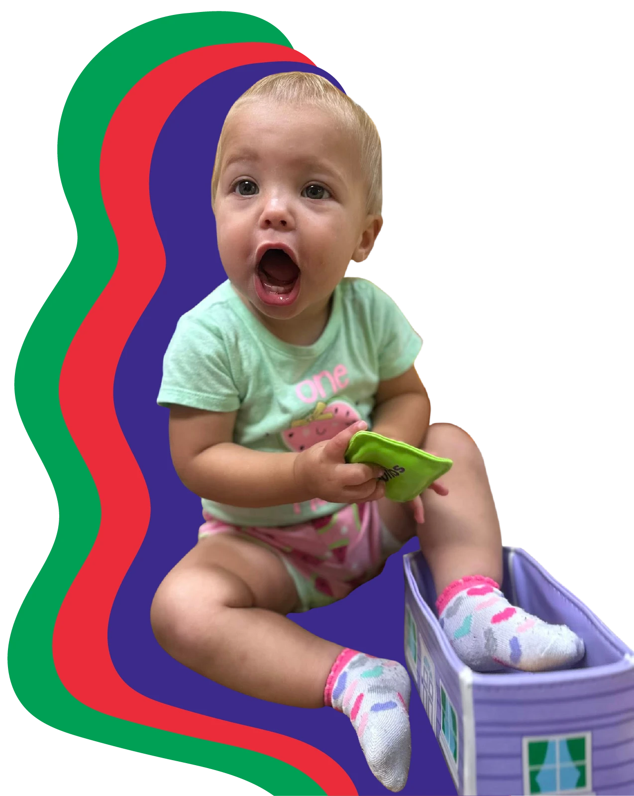 Baby with mouth  wide open excited playing with toys