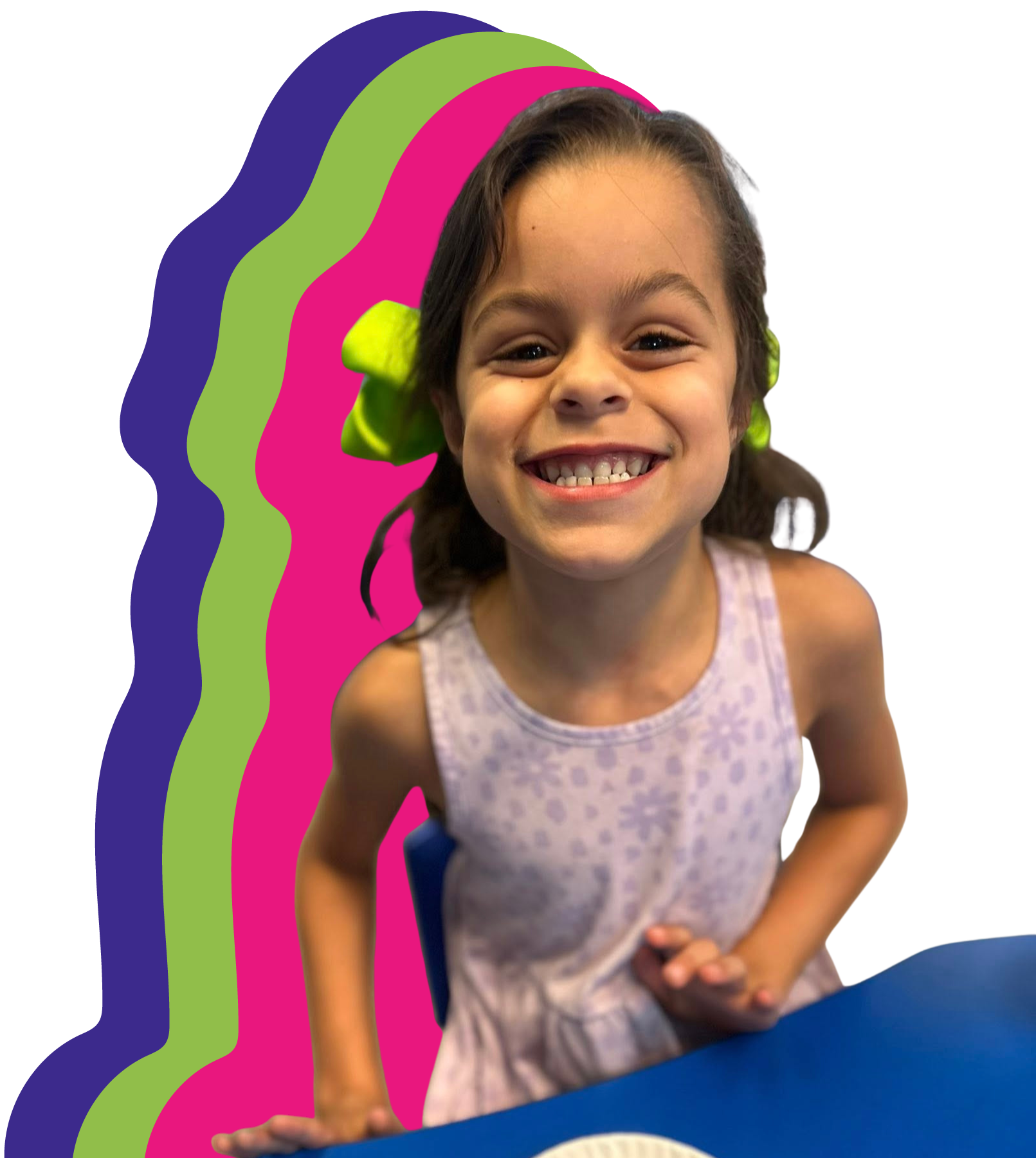 Female child smiling with green bows