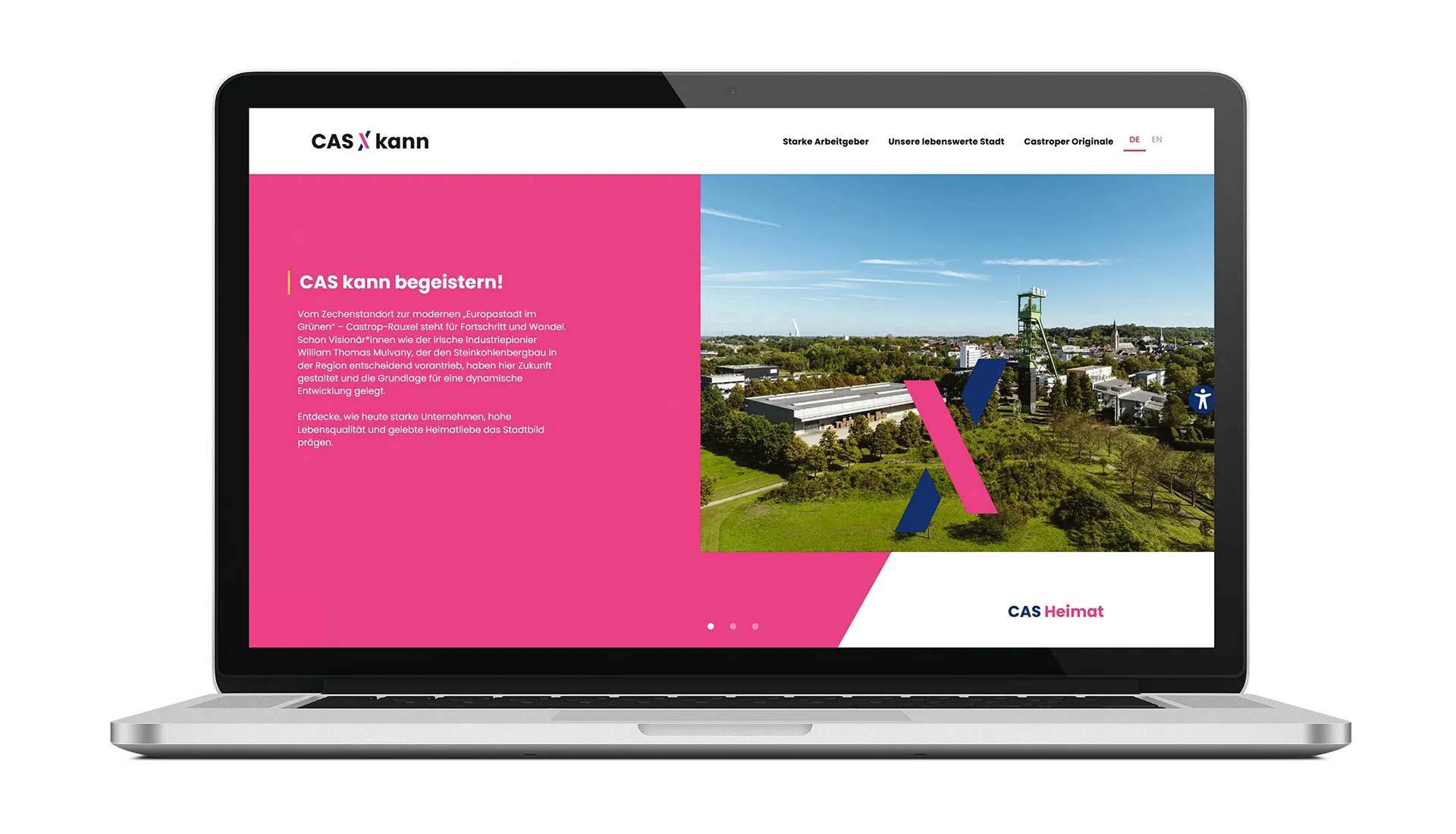Laptop zeigt eine Webseite mit dem Titel 'CAS kann begeistern!' und einem Bild einer grünen Stadtlandschaft mit Industrieanlagen.