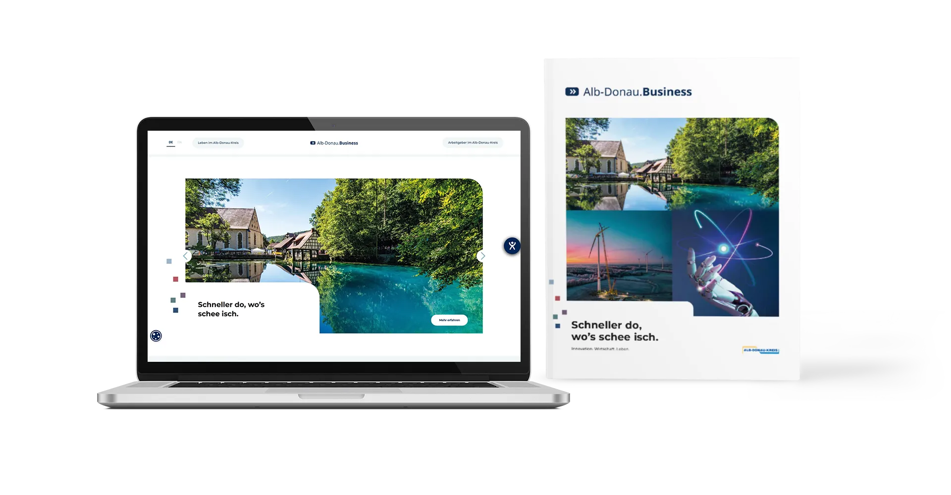 Laptop mit einer Website zum Alb-Donau-Kreis neben einem gedruckten Magazin mit Bildern von Natur, Windkraft und Technologie.