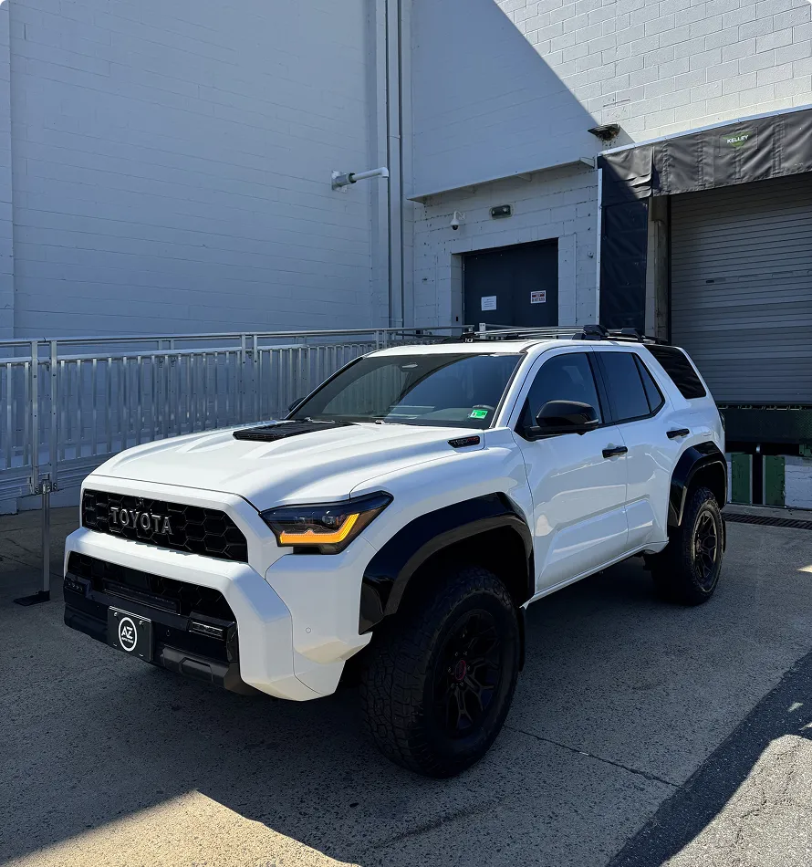 The 2026 Toyota 4Runner TRD Pro is a rugged off-road SUV built for serious trail performance and everyday adventure. Powered by a 2.4-liter turbocharged i-FORCE MAX hybrid engine with 326 horsepower, it features standard 4WD, TRD-tuned FOX shocks, 33-inch all-terrain tires, and a bold TRD Pro design.