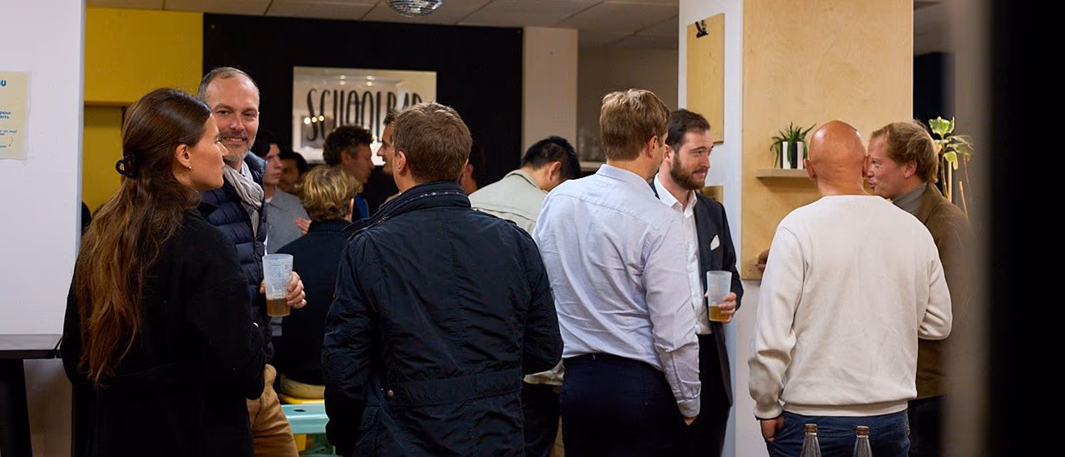 A group of people standing around each other.