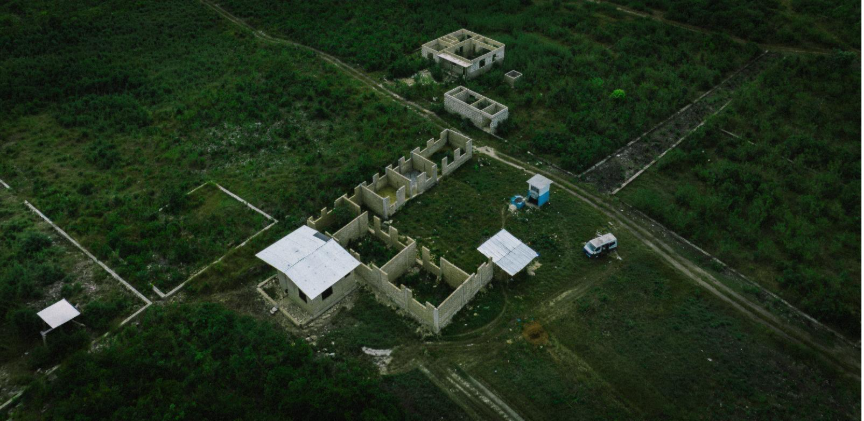 An aerial view of a buildingAI-generated content may be incorrect.