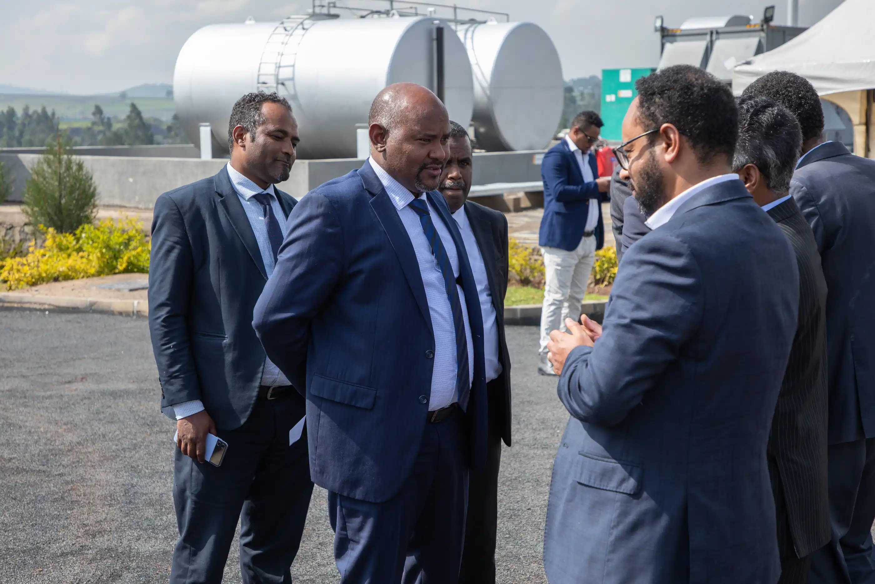 A group of people discussing business. 
